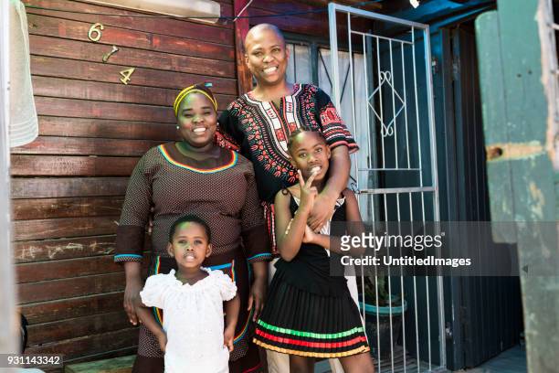 happy family together outdoors - slum africa stock pictures, royalty-free photos & images