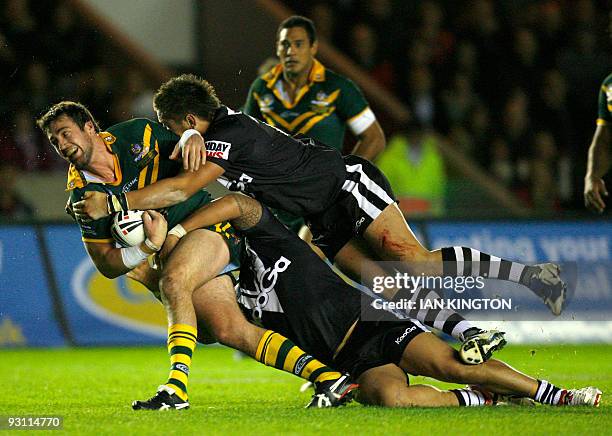 Trent Waterhouse Trent Waterhouse of Australia is tackled by Jeff Lima of New Zealand and Jarred Waerea-Hargreaves of New Zealand during a Four...