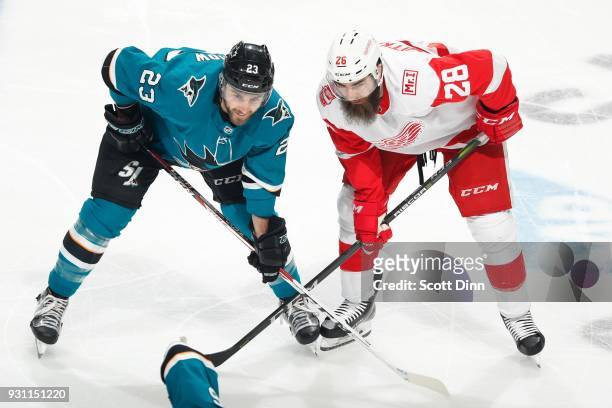 Barclay Goodrow of the San Jose Sharks and Luke Witkowski of the Detroit Red Wings get ready at SAP Center on March 12, 2018 in San Jose, California.