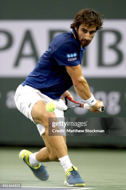 Pablo Cuevas of Uraguay plays Dominic Thiem of Austria during the BNP Paribas Open at the Indian Wells Tennis Garden on March 12, 2018 in Indian...