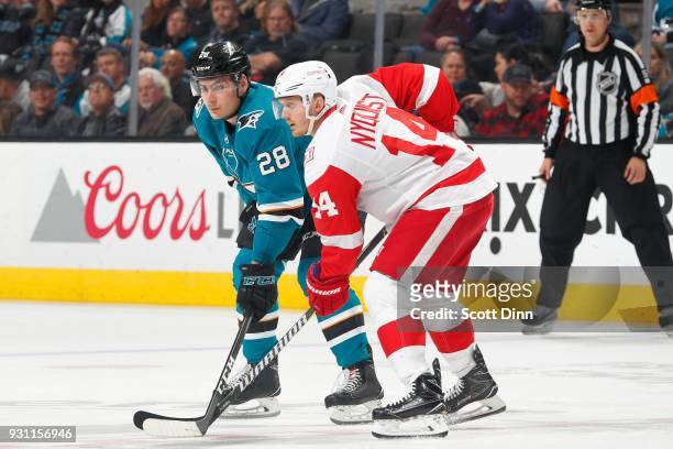 Timo Meier of the San Jose Sharks and Gustav Nyquist of the Detroit Red Wings get ready at SAP Center on March 12, 2018 in San Jose, California.