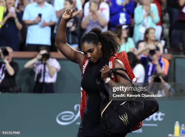 Serena Williams of United States waves to crowd after her loss to her sister Venus Williams during Day 8 of BNP Paribas Open on March 12, 2018 in...