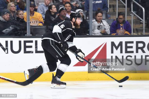 Jake Muzzin of the Los Angeles Kings handles the puck during a game against the Vancouver Canucks at STAPLES Center on March 12, 2018 in Los Angeles,...