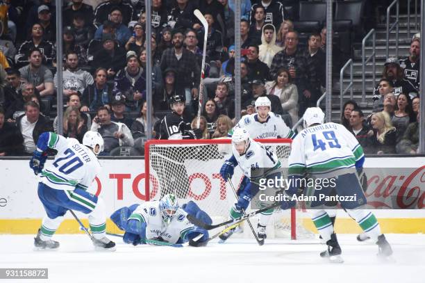 Anders Nilsson of the Vancouver Canucks makes a save during a game against the Los Angeles Kings at STAPLES Center on March 12, 2018 in Los Angeles,...
