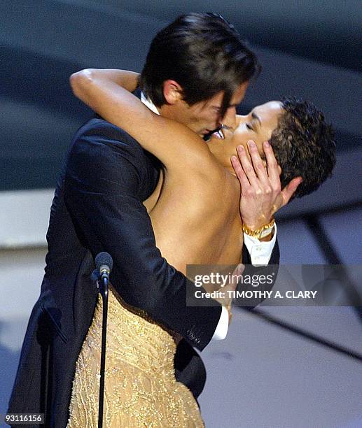 Actor Adrien Brody kisses presenter Actress Halle Berry as he accepts his Oscar for Performance by an actor in a leading role for his role in "The...