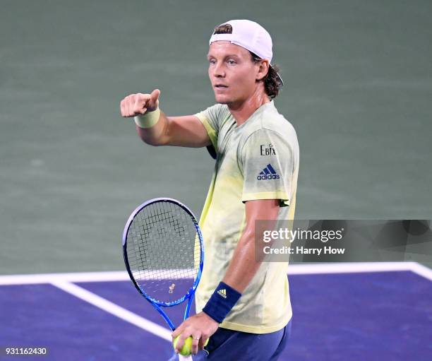 Tomas Berdych of the Czech Republic reacts toward an umpire for his missed call in his match against Hyeon Chung of South Korea during the BNP...