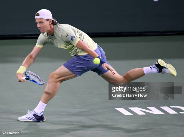 Tomas Berdych of the Czech Republic plays a running forehand in his match against Hyeon Chung of South Korea during the BNP Paribas Open at the...