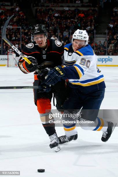 Rickard Rakell of the Anaheim Ducks battles for the puck against Nikita Soshnikov of the St. Louis Blues during the game on March 12, 2018 at Honda...