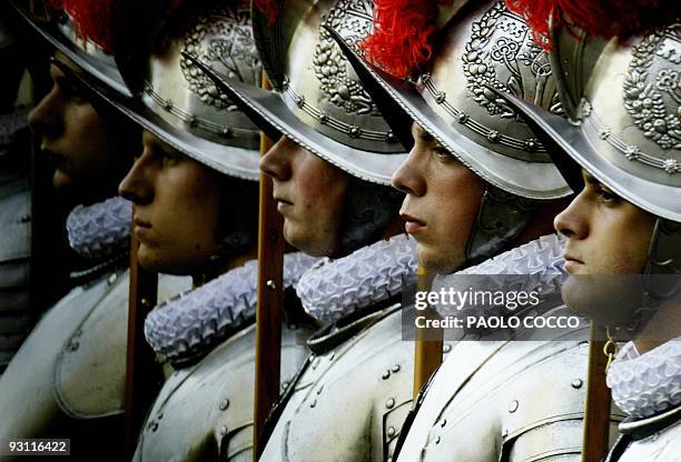 New Swiss Guard recruits stand during a swearing-in ceremony in the Vatican 06 May 2003. Pope John Paul II said "thank you" to his Swiss Guard on...