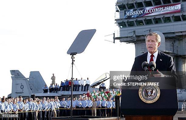 President George W. Bush addresses the nation aboard the nuclear aircraft carrier USS Abraham Lincoln 01 May as it sails for Naval Air Station North...