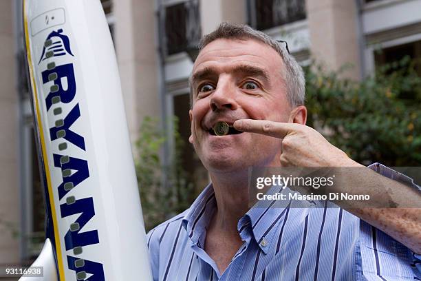 Ryanair CEO Michael O'Leary poses with a model airplane ahead of a press conference on November 17, 2009 in Milan, Italy. O'Leary presented the...