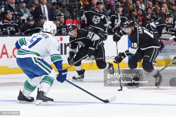 Alex Iafallo of the Los Angeles Kings handles the puck during a game against the Vancouver Canucks at STAPLES Center on March 12, 2018 in Los...