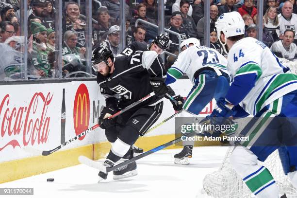 Torrey Mitchell of the Los Angeles Kings battles for the puck during a game against the Vancouver Canucks at STAPLES Center on March 12, 2018 in Los...