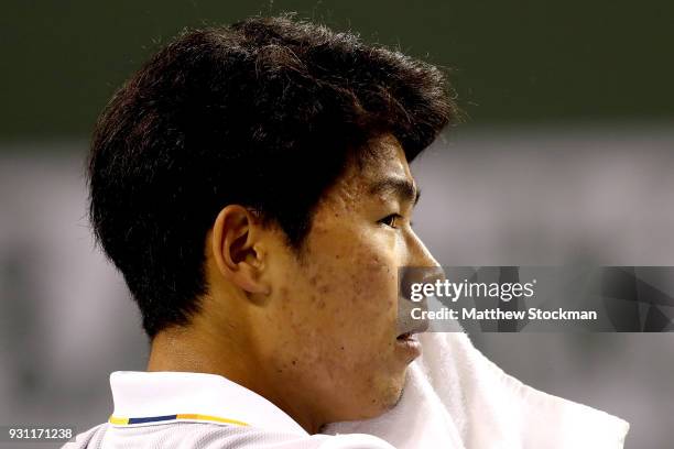 Hyeon Chung of Korea cools down between games while playing Tomas Berdych of Czech Republic during the BNP Paribas Open at the Indian Wells Tennis...