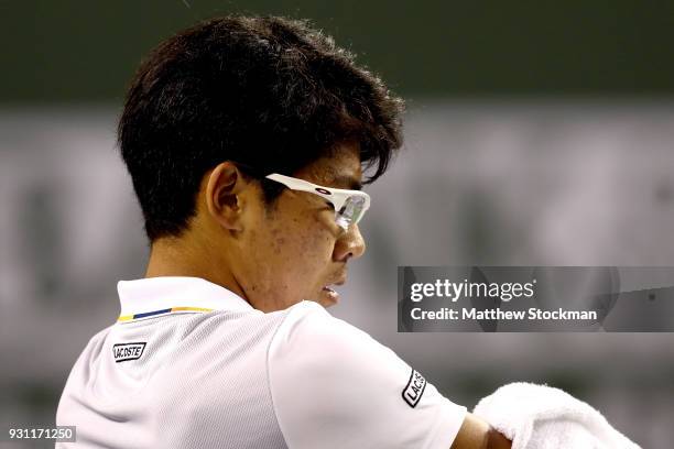 Hyeon Chung of Korea cools down between games while playing Tomas Berdych of Czech Republic during the BNP Paribas Open at the Indian Wells Tennis...