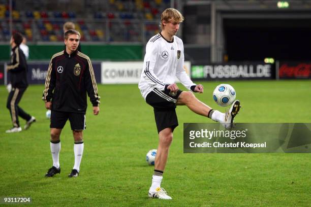 Philipp Lahm of Germany watches team mate Stefan Kiessling juggling with the ball during a German National team training session at the Esprit Arena...