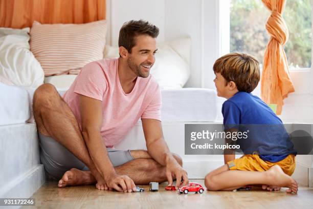 you get to know your kids when you play with them - boy playing with cars stock pictures, royalty-free photos & images