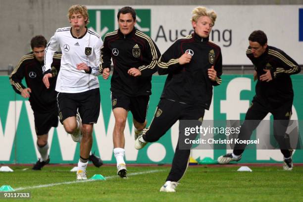 Arne Friedrich, Stefan Kiessling, Marcel Schafer, Andreas Beck and Christian Gentner of Germany run during a German National team training session at...