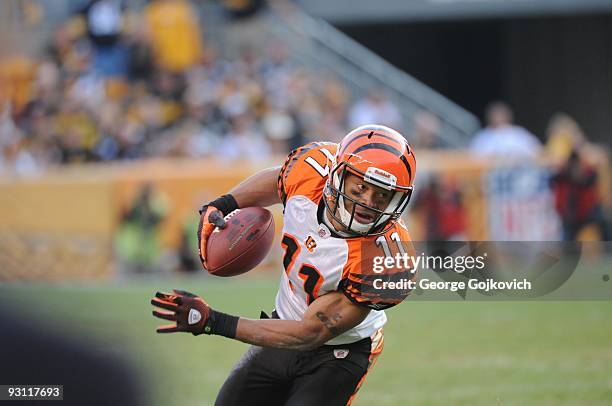 Wide receiver Laveranues Coles of the Cincinnati Bengals runs with the football after catching a pass against the Pittsburgh Steelers during a game...