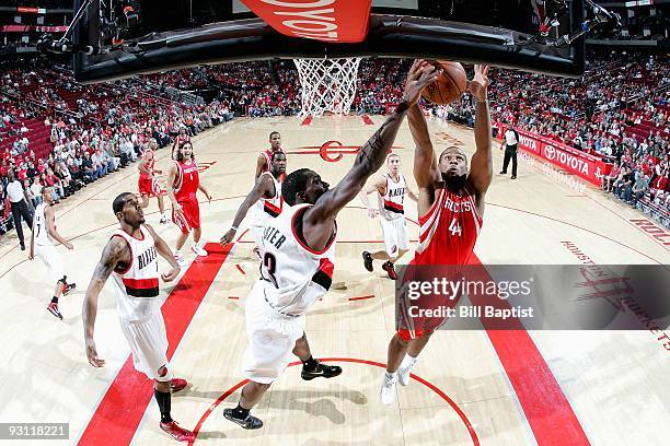 Chuck Hayes of the Houston Rockets goes to the basket against Martell Webster of the Portland Trail Blazers during the game on October 31, 2009 at...
