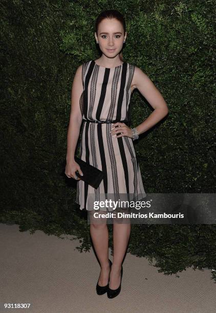 Lily Collins walks the red carpet at The CFDA/Vogue Fashion Fund Awards at Skylight Studio on November 16, 2009 in New York City.