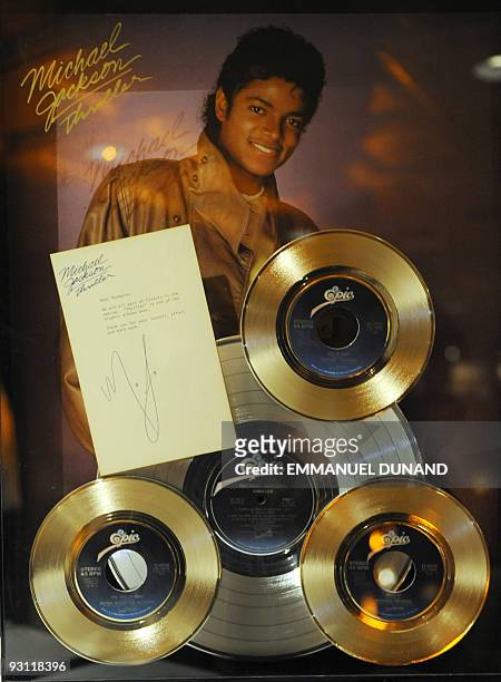 Gold and platium Michael Jackson's "thriller" records are on display ay at an auction preview in New York, November 17, 2009. A series of Jackson...
