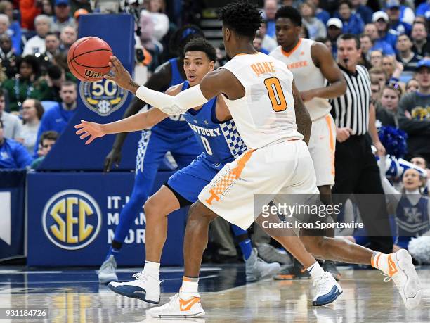 Kentucky guard Quade Green asses the ball with Tennessee guard Jordan Bone guarding during a Southeastern Conference Basketball Tournament game...