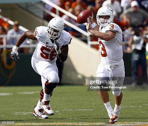 Quarterback Garrett Gilbert of the Texas Longhorns drops back to pass as lineman Tray Allen provided protection during the second half against the...
