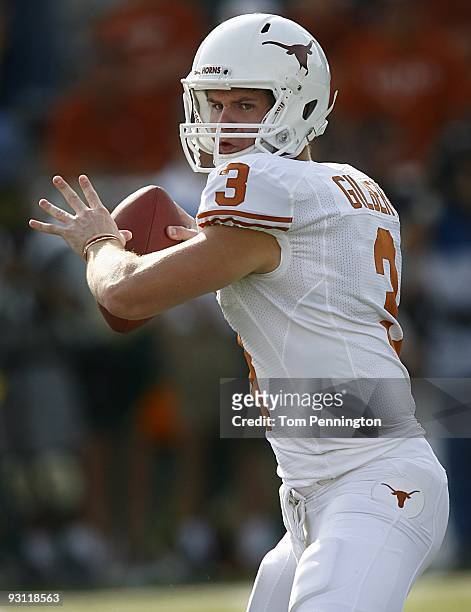 Quarterback Garrett Gilbert of the Texas Longhorns drops back to pass during the second half against the Baylor Bears on November 14, 2009 at Floyd...