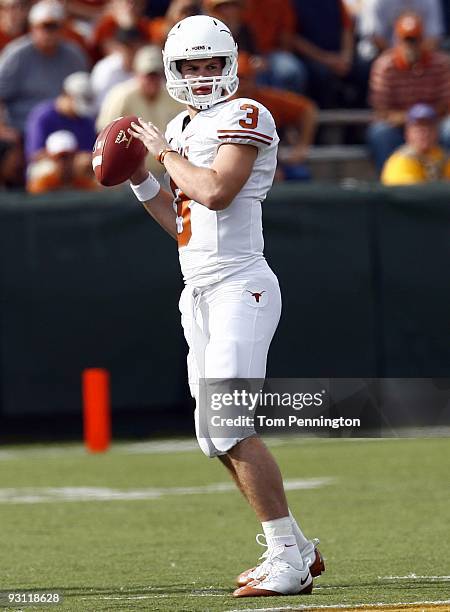 Quarterback Garrett Gilbert of the Texas Longhorns drops back to pass during the second half against the Baylor Bears on November 14, 2009 at Floyd...