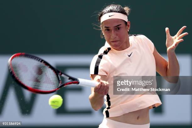 Caroline Garcia of France returns a shot to Daria Gavrilova of Australia during the BNP Paribas Open at the Indian Wells Tennis Garden on March 12,...