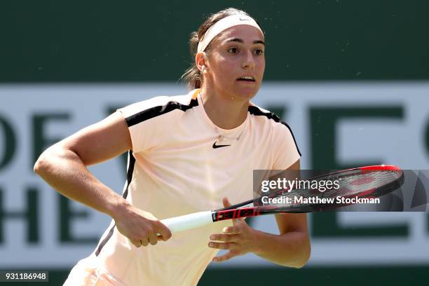 Caroline Garcia of France returns a shot to Daria Gavrilova of Australia during the BNP Paribas Open at the Indian Wells Tennis Garden on March 12,...