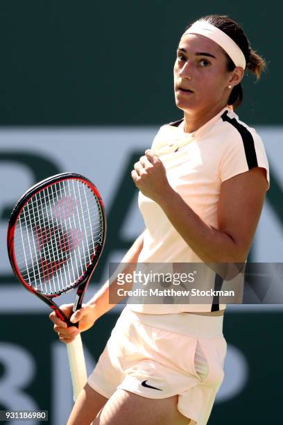 Caroline Garcia of France celebrates a point against Daria Gavrilova of Australia during the BNP Paribas Open at the Indian Wells Tennis Garden on...