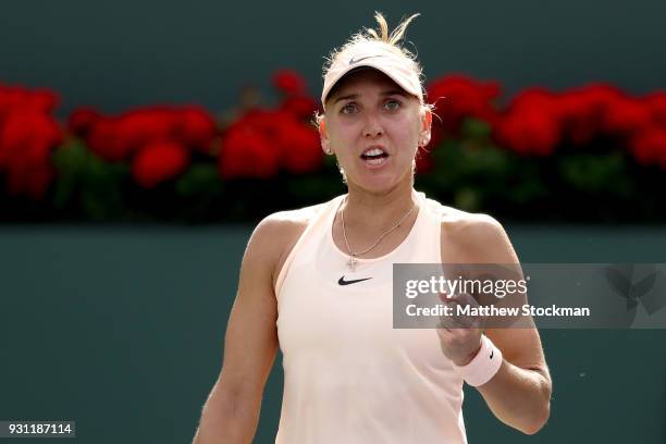 Elena Vesnina of Russia celebrates a point against Angelique Kerber of Germany during the BNP Paribas Open at the Indian Wells Tennis Garden on March...