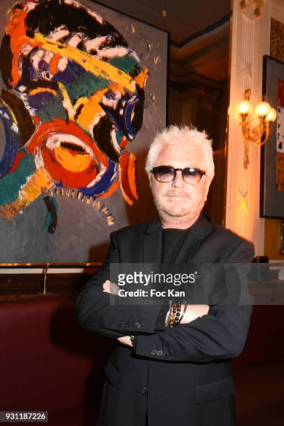 Marc Cerrone poses with his work during Marc Cerrone Exhibition Preview at Deux Magots on March 12, 2018 in Paris, France.