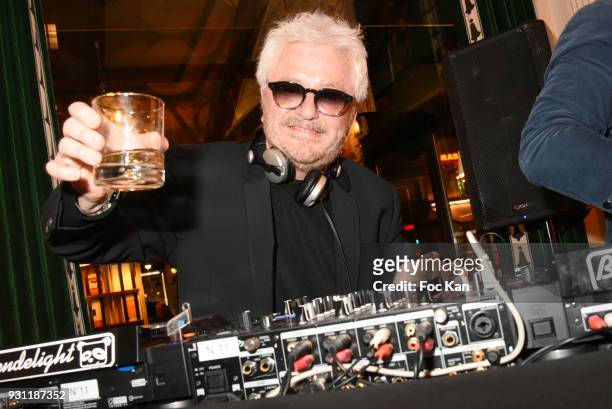 Marc Cerrone performs as DJ during Marc Cerrone Exhibition Preview at Deux Magots on March 12, 2018 in Paris, France.