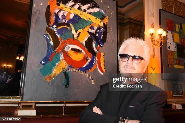 Marc Cerrone poses with his work during Marc Cerrone Exhibition Preview at Deux Magots on March 12, 2018 in Paris, France.