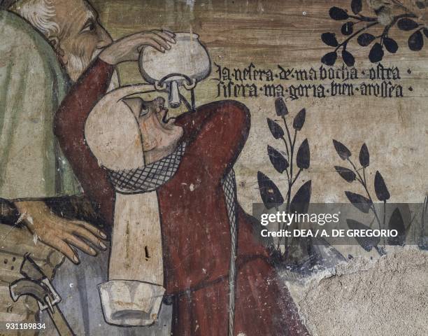 Servant drinking from a kind of a hip flask, detail from the Fountain of Youth, fresco in the Baronial Hall, Castle of Manta, Saluzzo, Piedmont....