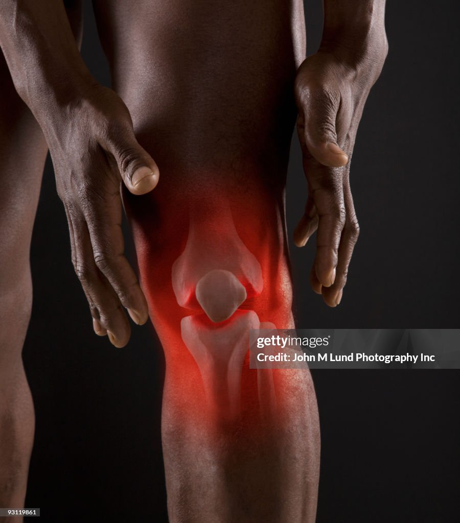 Joints of mixed race man's knee