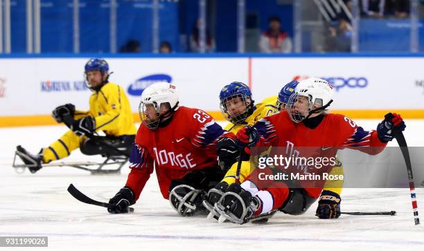 Lena Schroeder of Norway in action against Sweden in the Ice Hockey Preliminary Round - Group A game between Norway and Sweden during day four of the...