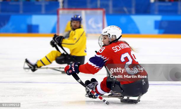 Lena Schroeder of Norway in action against Sweden in the Ice Hockey Preliminary Round - Group A game between Norway and Sweden during day four of the...