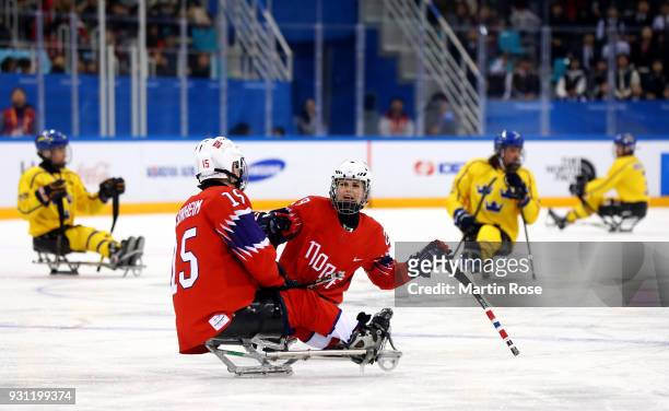 Lena Schroeder of Norway in action against Sweden in the Ice Hockey Preliminary Round - Group A game between Norway and Sweden during day four of the...