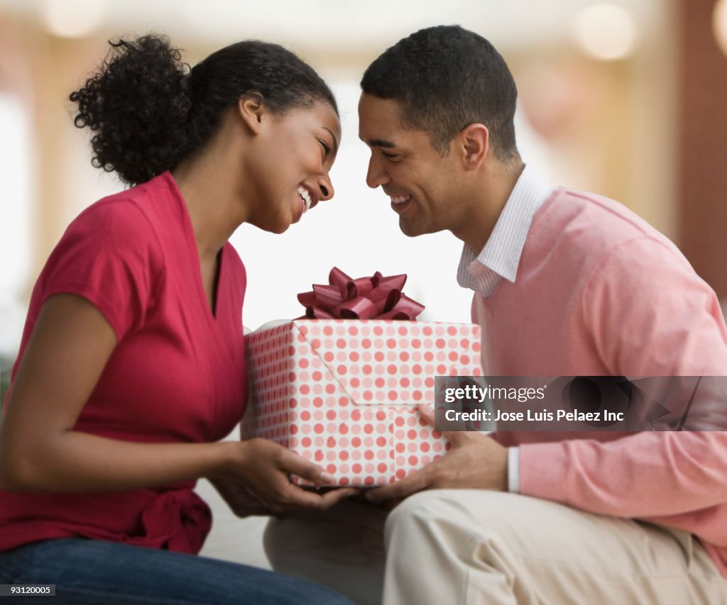 Couple holding gift