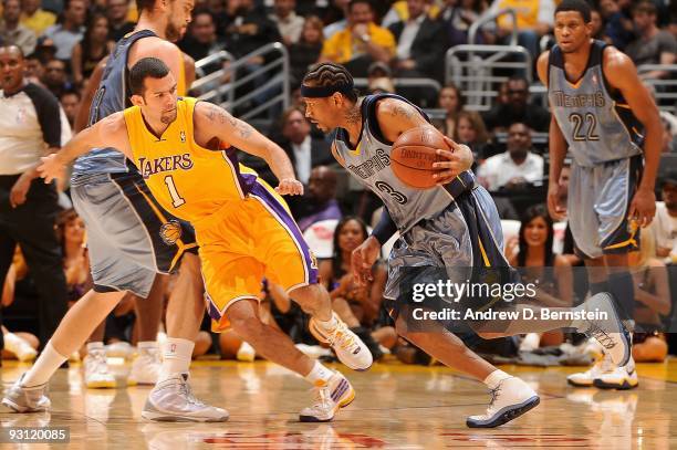 Allen Iverson of the Memphis Grizzlies drives against Jordan Farmar of the Los Angeles Lakers during the game on November 6, 2009 at Staples Center...