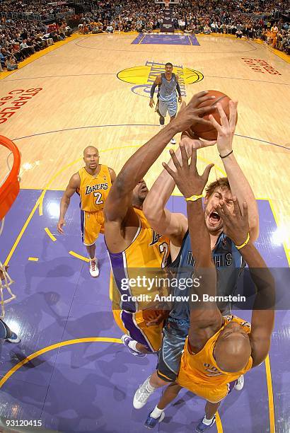 Marc Gasol of the Memphis Grizzlies goes to the basket under pressure against DJ Mbenga and Lamar Odom of the Los Angeles Lakers during the game on...