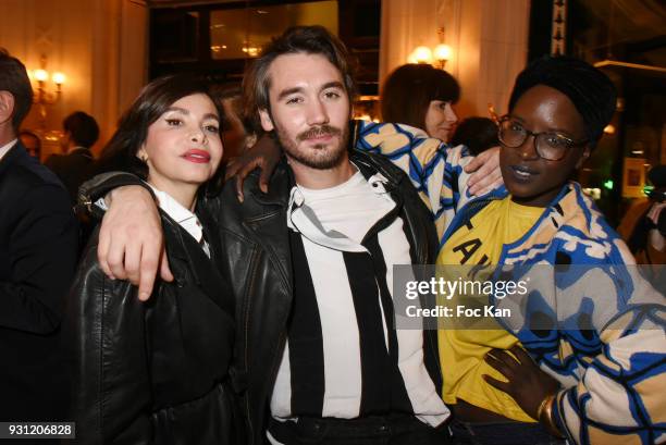 Frederique Lopez, Benjamin Belin and Fate Damn attend Marc Cerrone Exhibition Preview at Deux Magots a on March 12, 2018 in Paris, France.