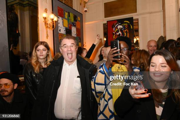 Lea Rostain and her father photographer Pascal Rostain attend Marc Cerrone Exhibition Preview at Deux Magots a on March 12, 2018 in Paris, France.