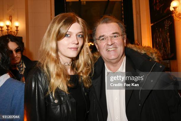 Lea Rostain and her father photographer Pascal Rostain attend Marc Cerrone Exhibition Preview at Deux Magots a on March 12, 2018 in Paris, France.