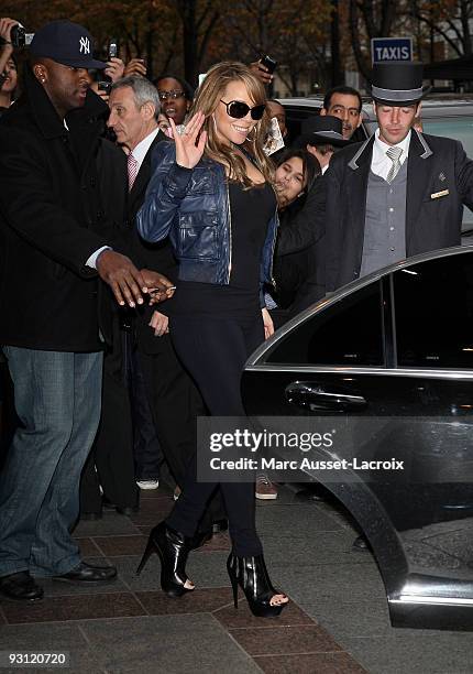 Mariah Carey waves as she leaves Hotel George V, while visiting to promote her new album "Memoirs Of An Imperfect Angel", on November 17, 2009 in...