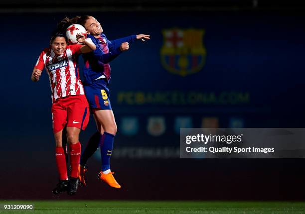 Melanie Serrano of Barcelona competes for the ball with Vaitieri Kenti of Atletico de Madrid during the Liga Femenina match between FC Barcelona...